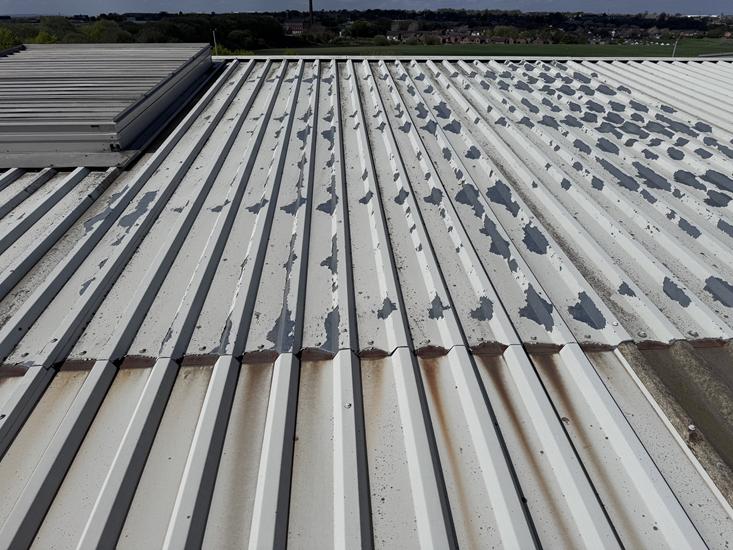 Image showing a metal roof prior to refurbishment