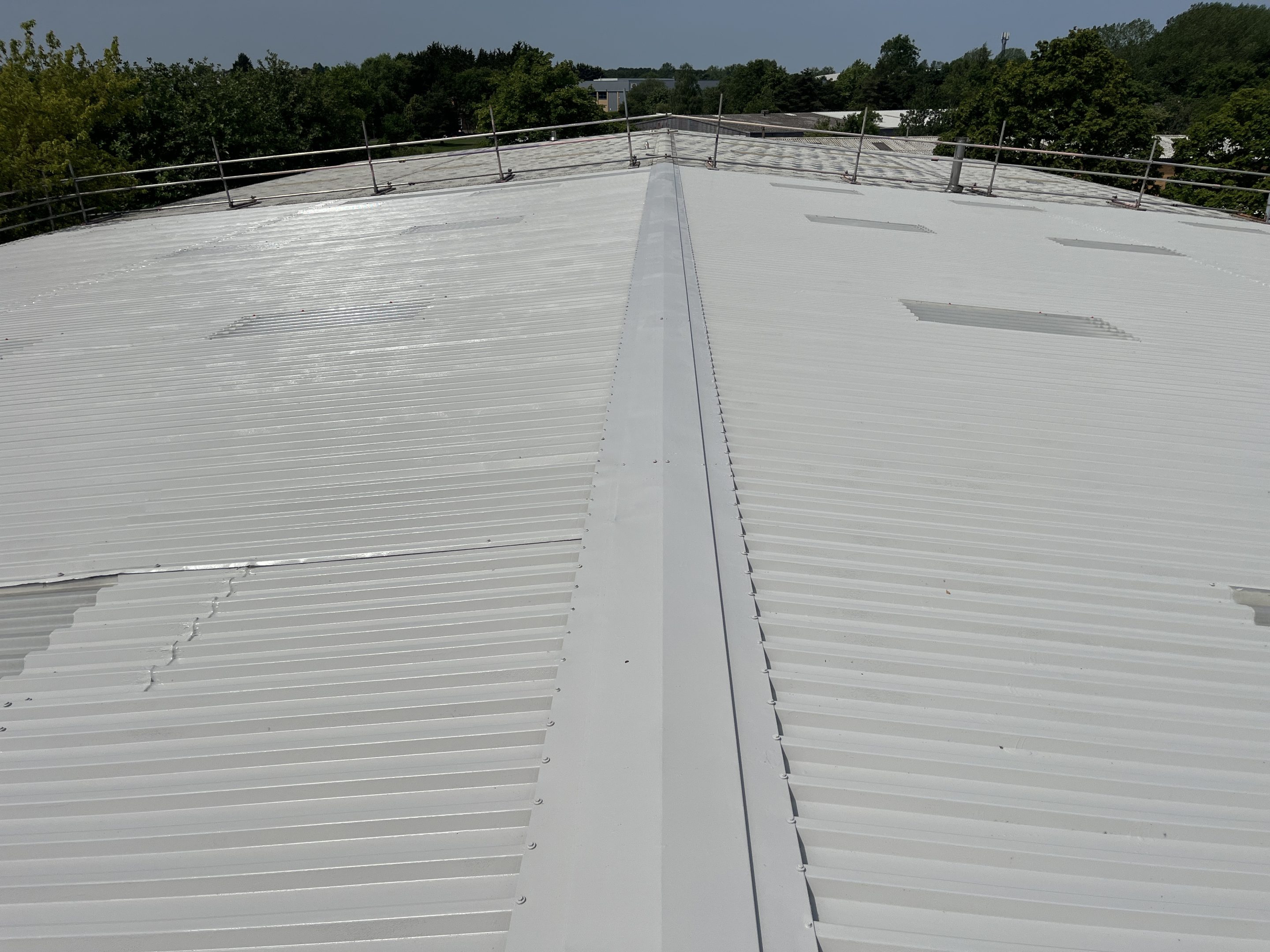Image showing Liquasil Lite general purpose roof coating system to a metal profiled roof.<br />