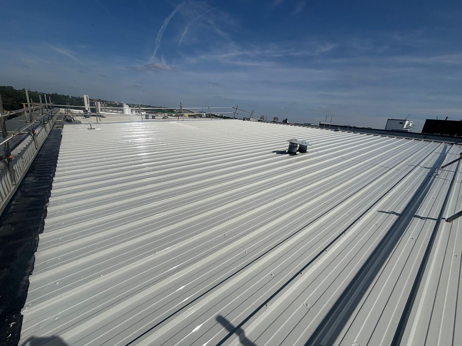 Image showing a completed metal roof coating project using Liquasil's BBA Approved Metalseal 20 roof refurbishment system.