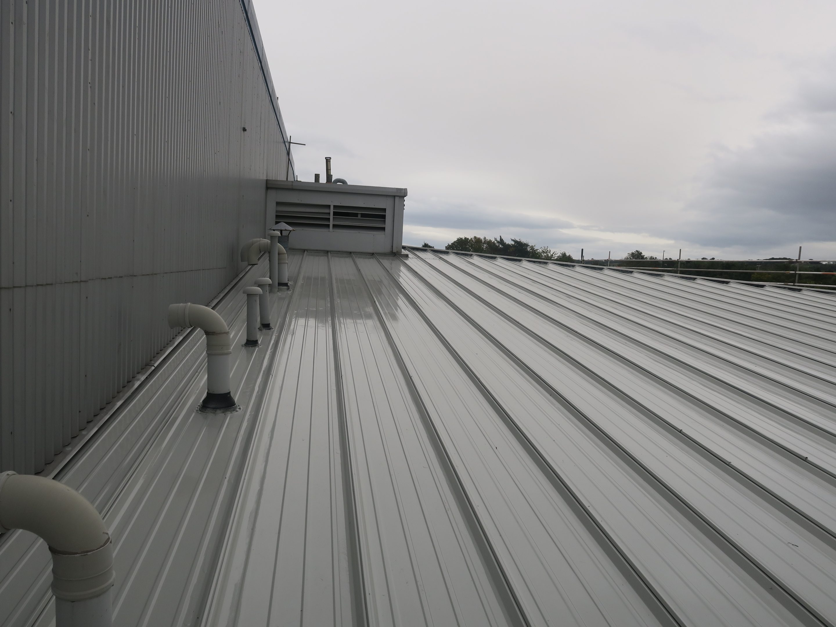 Image showing Liquasil's Metalseal metal roof coating applied to a factory roof in Washington, UK