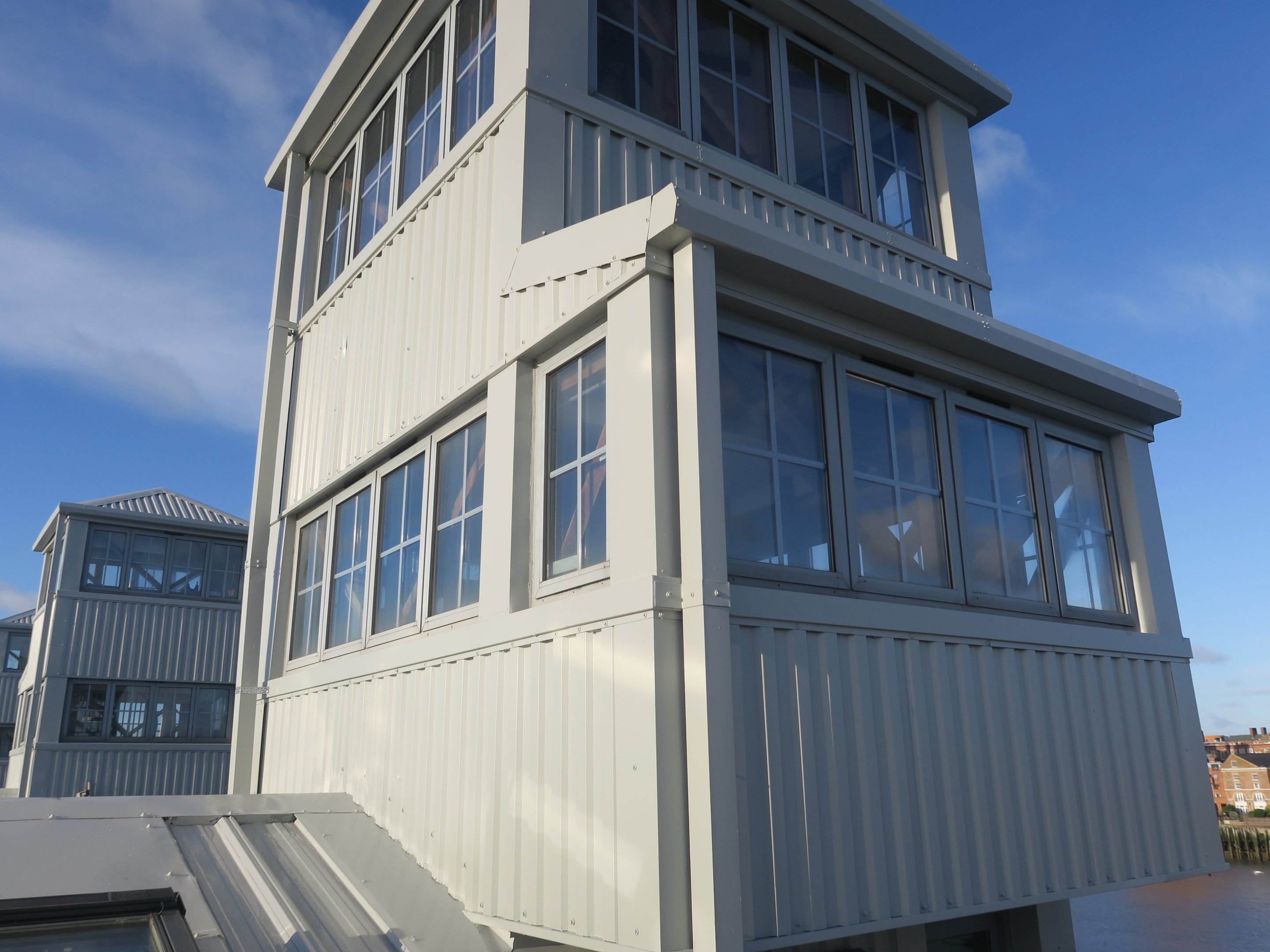 Image shows the vertical cladding to an industrial building coated with Liquasil's Cladcoat system