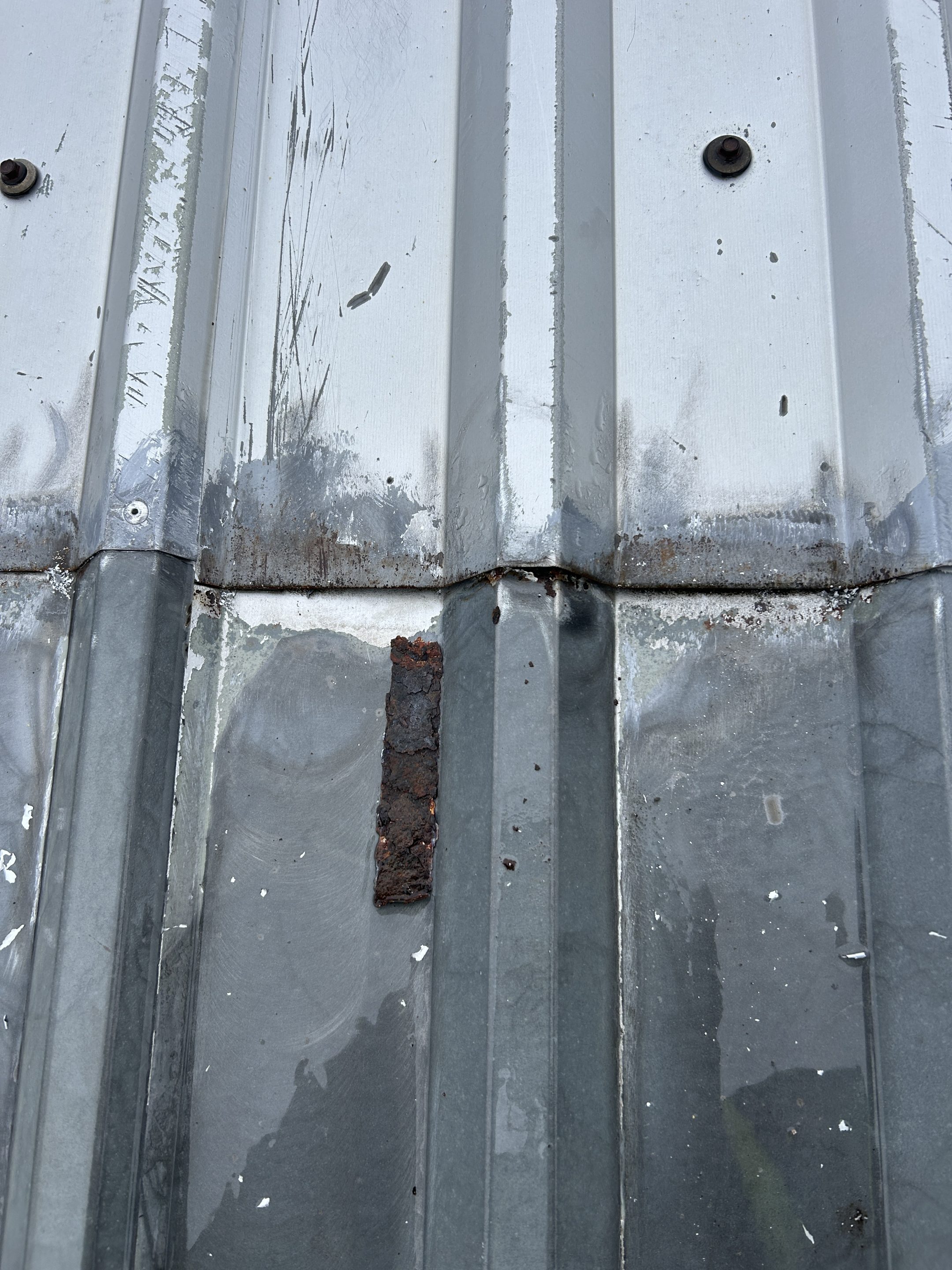 Image showing corrosion removed from mid-lap following inspection to determine whether a butyl seal was present