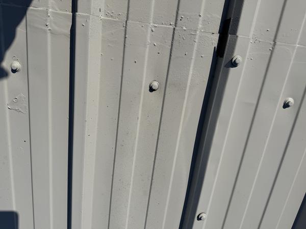 image showing a roof coating applied over active corrosion