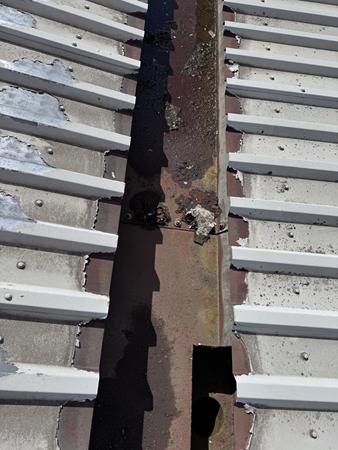 Image showing typical end-lap corrosion to the valleys of a metal roof