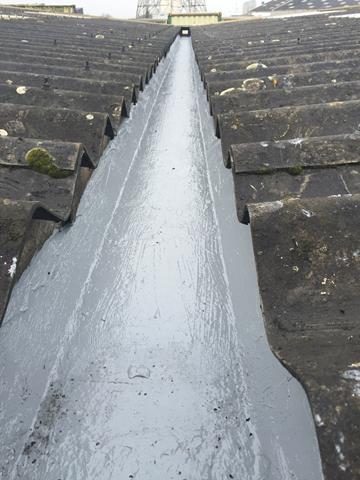 Liquasil liquid gutter liner in an asbestos gutter