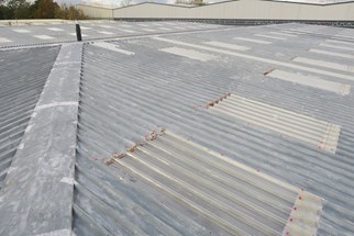 Image showing a metal roof being prepared for coating<br />