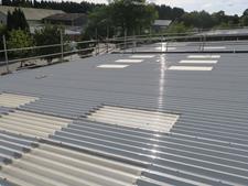 image showing a metal roof coating project using Liquasil's Metalseal 20