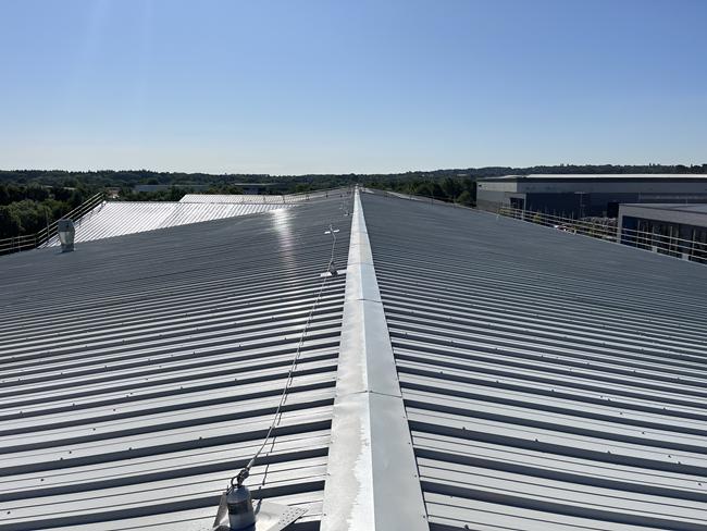Image showing a steel profiled roof having been coated with Liquasil's BBA Approved Metalseal metal roof coating