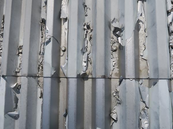 Image showing delainating PVDF finish to a steel roof