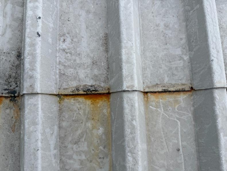 Image showing rust staining to a mid-lap joint on a recently coated steel profiled roof