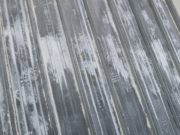 Image showing a section of roof after being treated with mordant t-wash solution